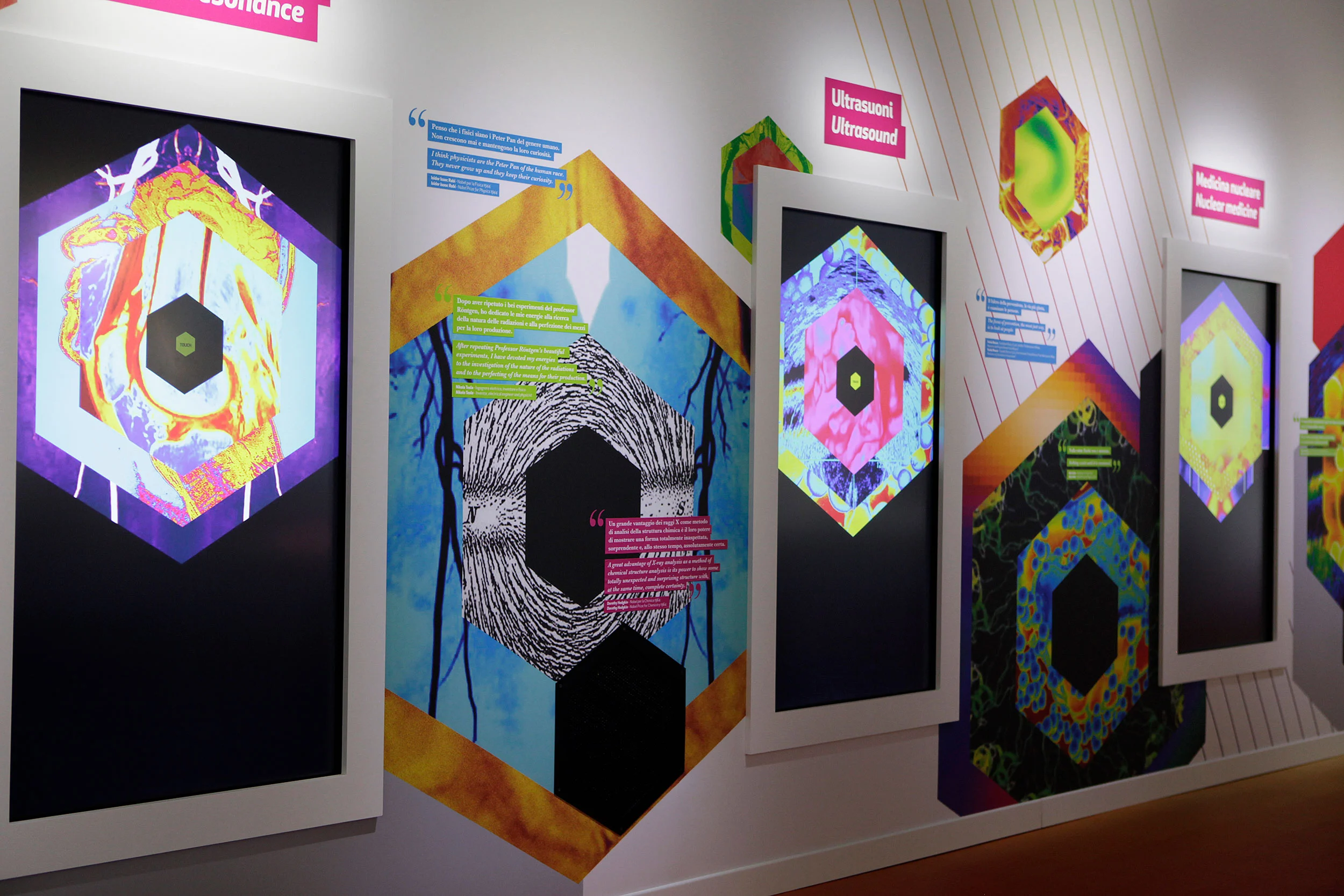 Wall of hexagonal panels with brightly coloured imaging graphics for ultrasound and other techniques – Bracco The Beauty of Imaging, Milan, Italy, 2017 – exhibition design