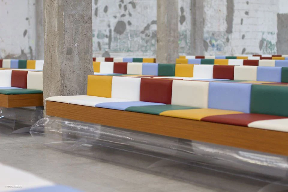 Benches with coloured leather cushions on wooden bases resting on inflatable clear plastic tubes – Marni Spring 2017 Ready-to-Wear, Milan, Italy – fashion show set design