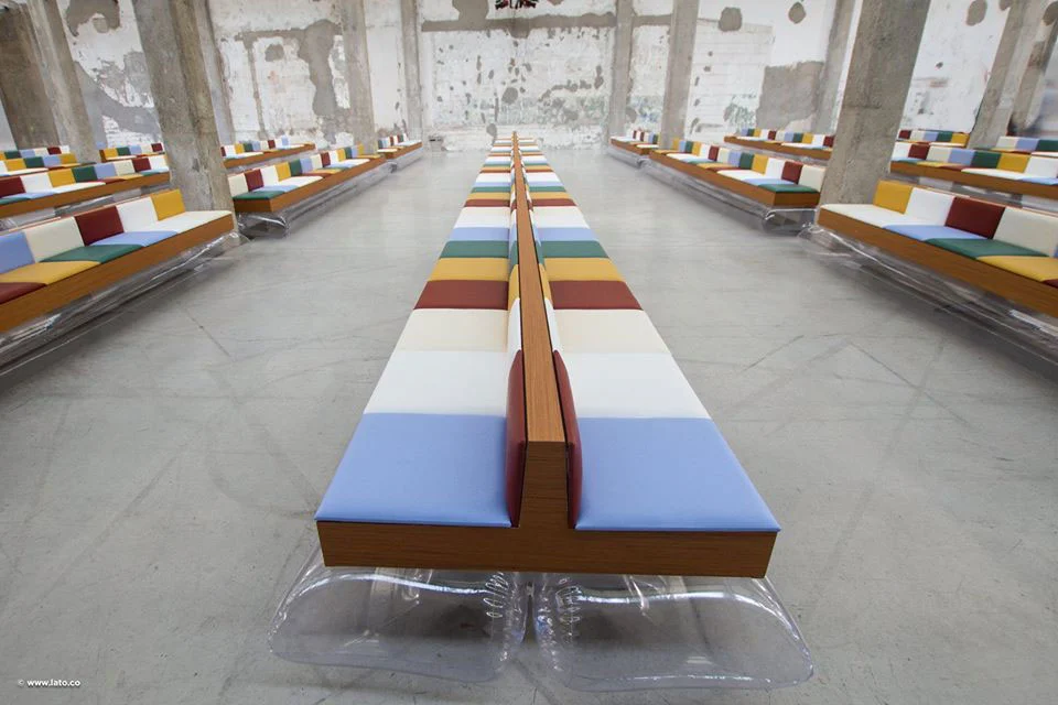 Long rows of multicoloured benches converging towards the back of the industrial hall – Marni Spring 2017 Ready-to-Wear, Milan, Italy – fashion show set design
