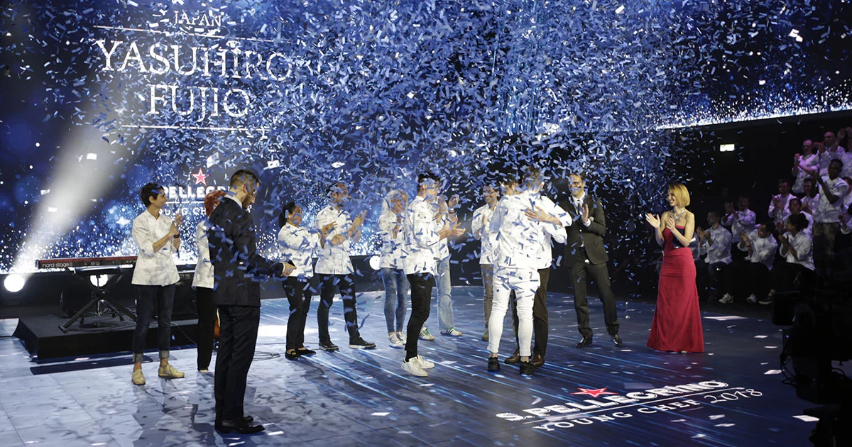 Confetti falling over chefs on stage as the winner's name appears on the screen behind – S.Pellegrino Young Chef, Milan, Italy, 2019 – event design