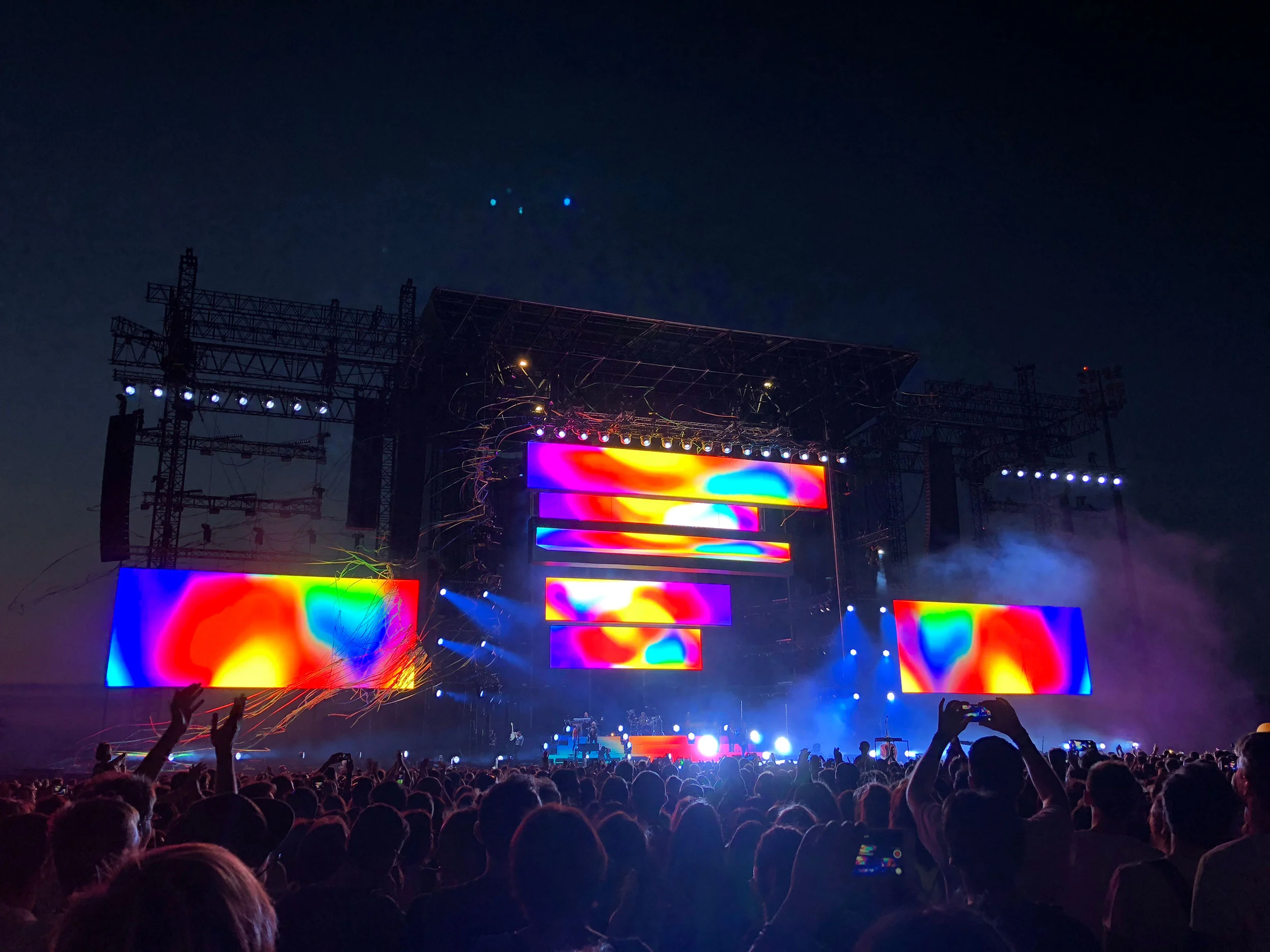 Stadium stage at night from the crowd, colourful video bars on a steel structure – Cesare Cremonini Stadi 2018, Italy – concert stage design