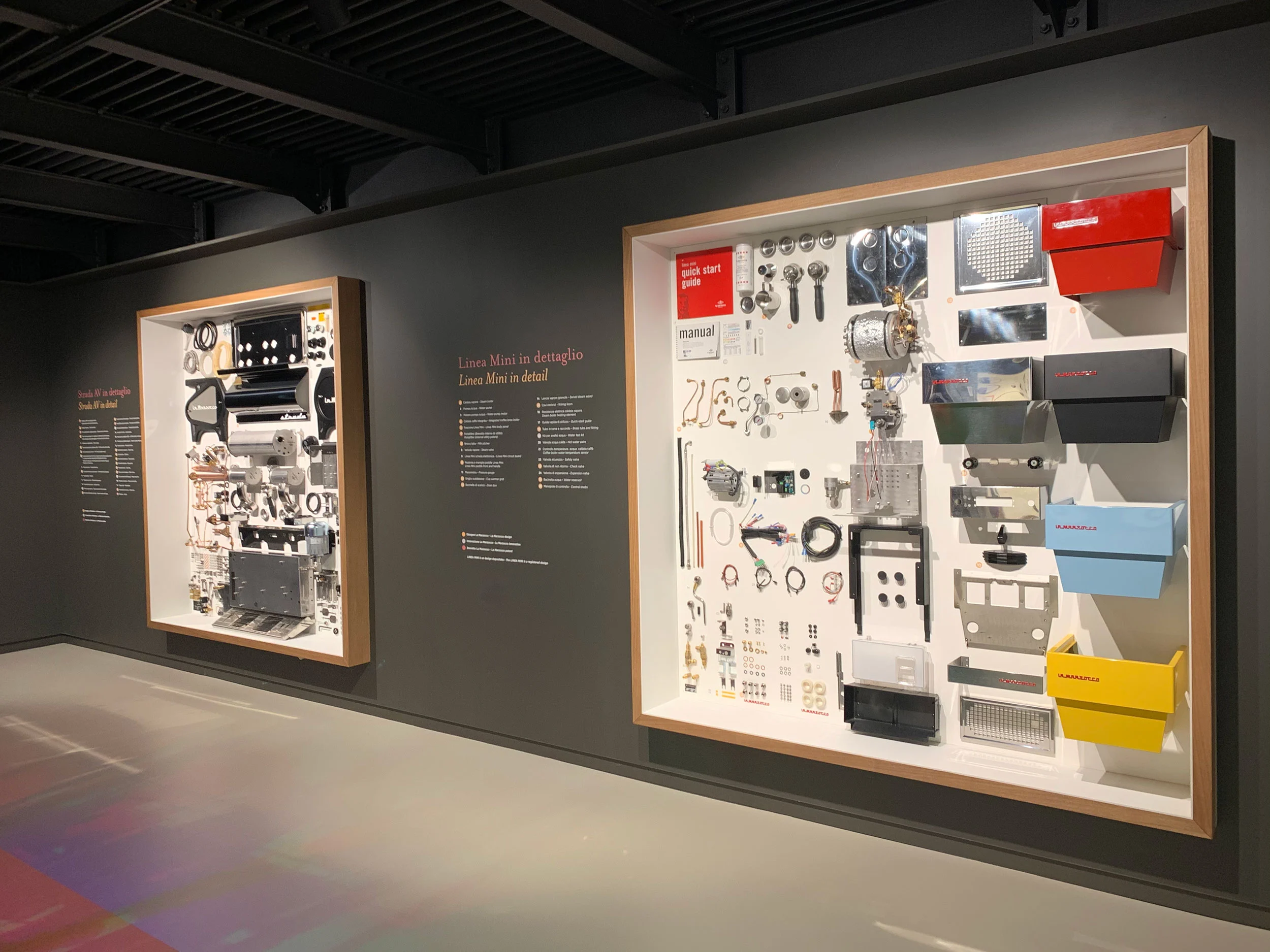 Two wall cases displaying the exploded components of an espresso machine, each part laid out – La Marzocco Accademia del Caffè Espresso, Florence, Italy, 2018 – interior design
