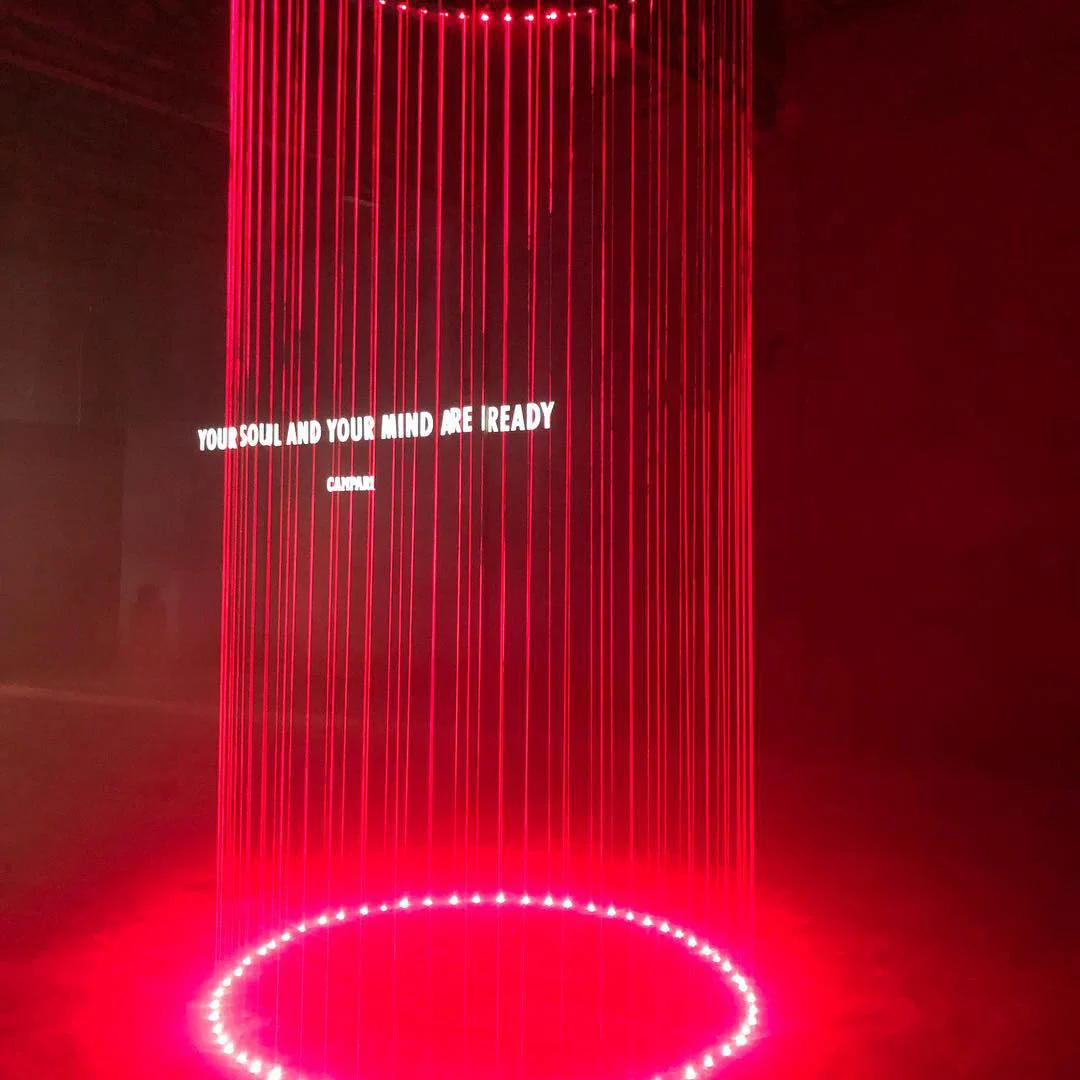 Circle of red light strings with the projected words Your soul and your mind are ready – Campari Red Diaries, Milan, Italy, 2017 – event design