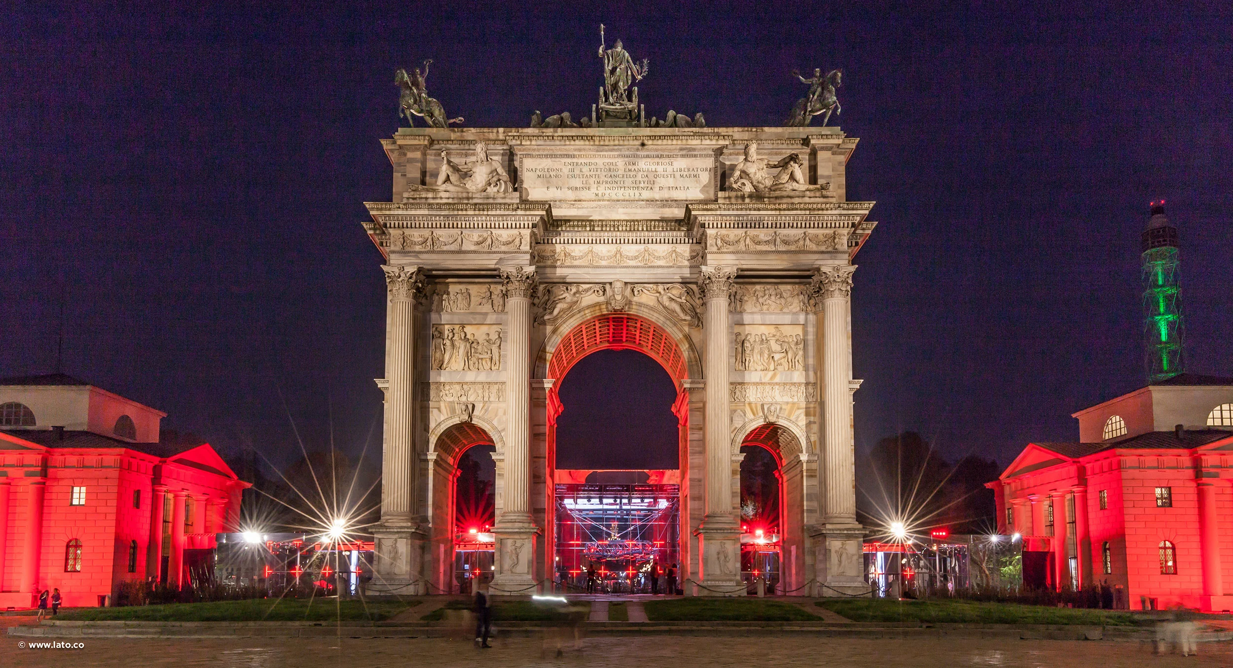 Front night view of the Arco della Pace with the red-lit pavilion framed inside the central arch – Cartier The Legendary Thrill, Milan, Italy, 2018 – event design