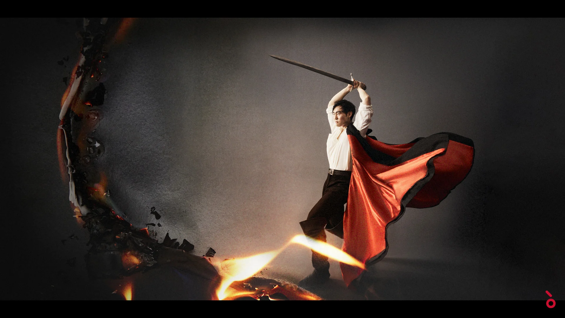 Key visual: a man in a white shirt raising a sword, red cape flying, against a dark backdrop with fiery cracks – Il Trovatore at Sydney Opera House, Australia, 2022 – set design