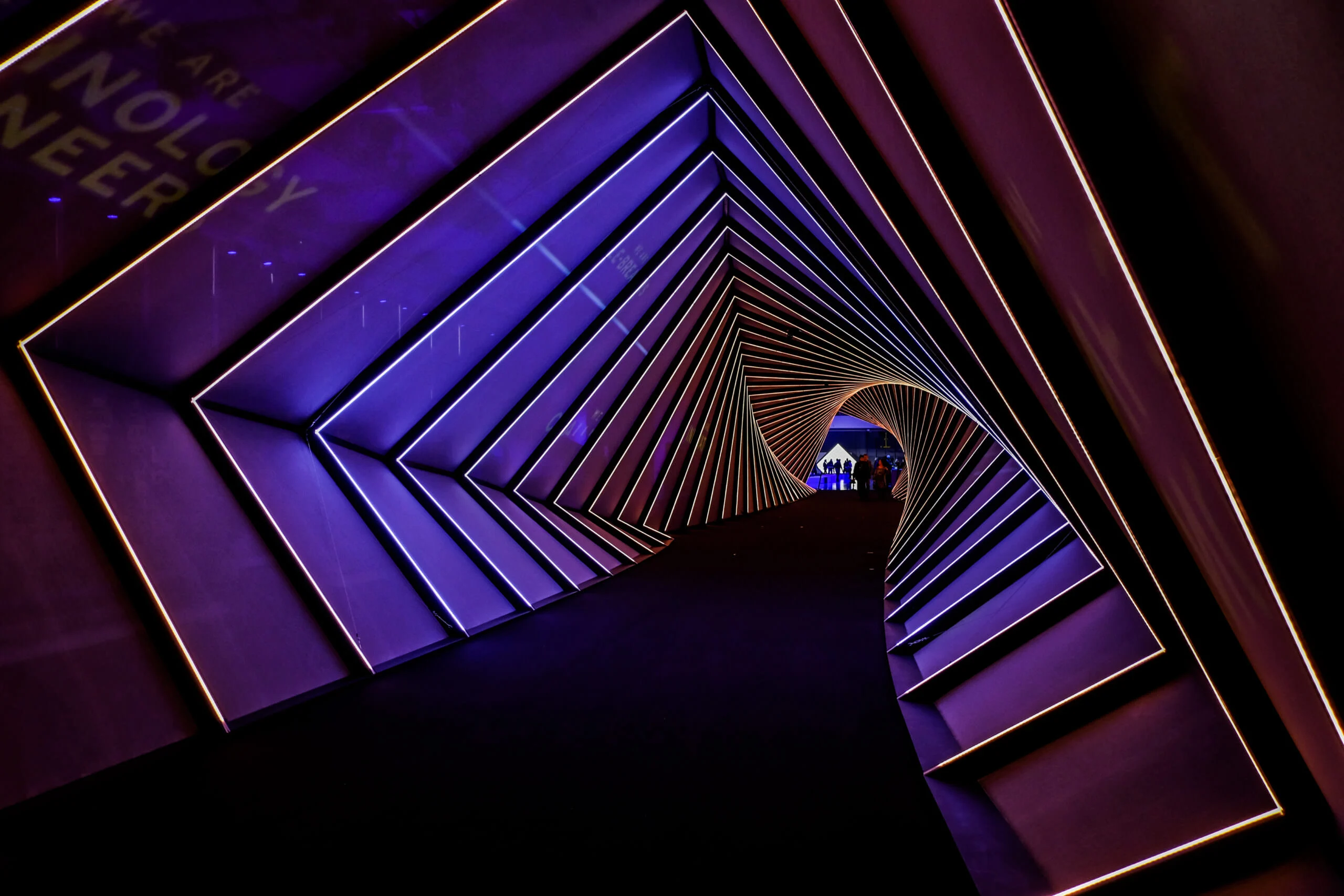 Twisting tunnel of purple light frames spiralling towards a lit exit – Lamborghini Urus World Premiere, Sant'Agata Bolognese, Italy, 2017 – event design