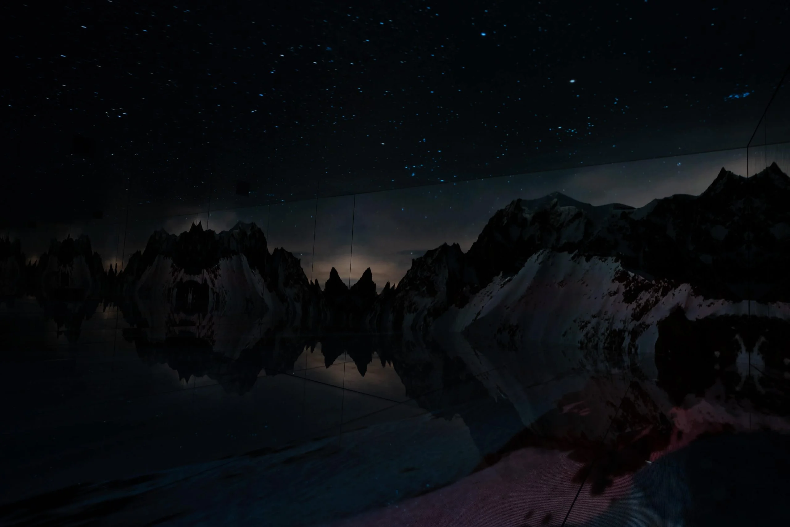 Night scene in the Infinity Room: starry sky above dark mountain ridges reflected in the mirrors – Mont Blanc Infinity Room at Skyway, Courmayeur, Italy, 2023 – installation design