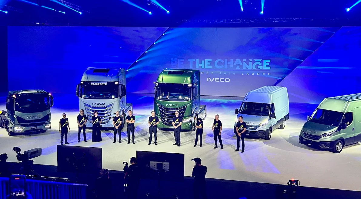 Iveco trucks and vans lined up on the Be The Change stage, presenters standing in front – IVECO Be The Change Launch, Barcelona, Spain, 2023 – event design