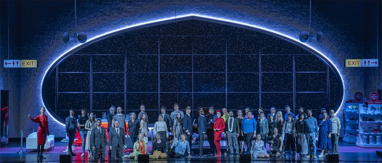 Full cast lined up across the stage before the oval window glowing with starlight – Une Folle Journée Mozart Gala, Salzburg, Austria, 2024 – opera set design