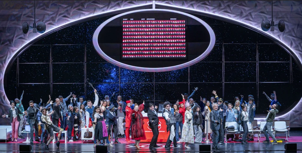Night scene with a starry sky in the oval window and the cast celebrating with raised arms – Une Folle Journée Mozart Gala, Salzburg, Austria, 2024 – opera set design