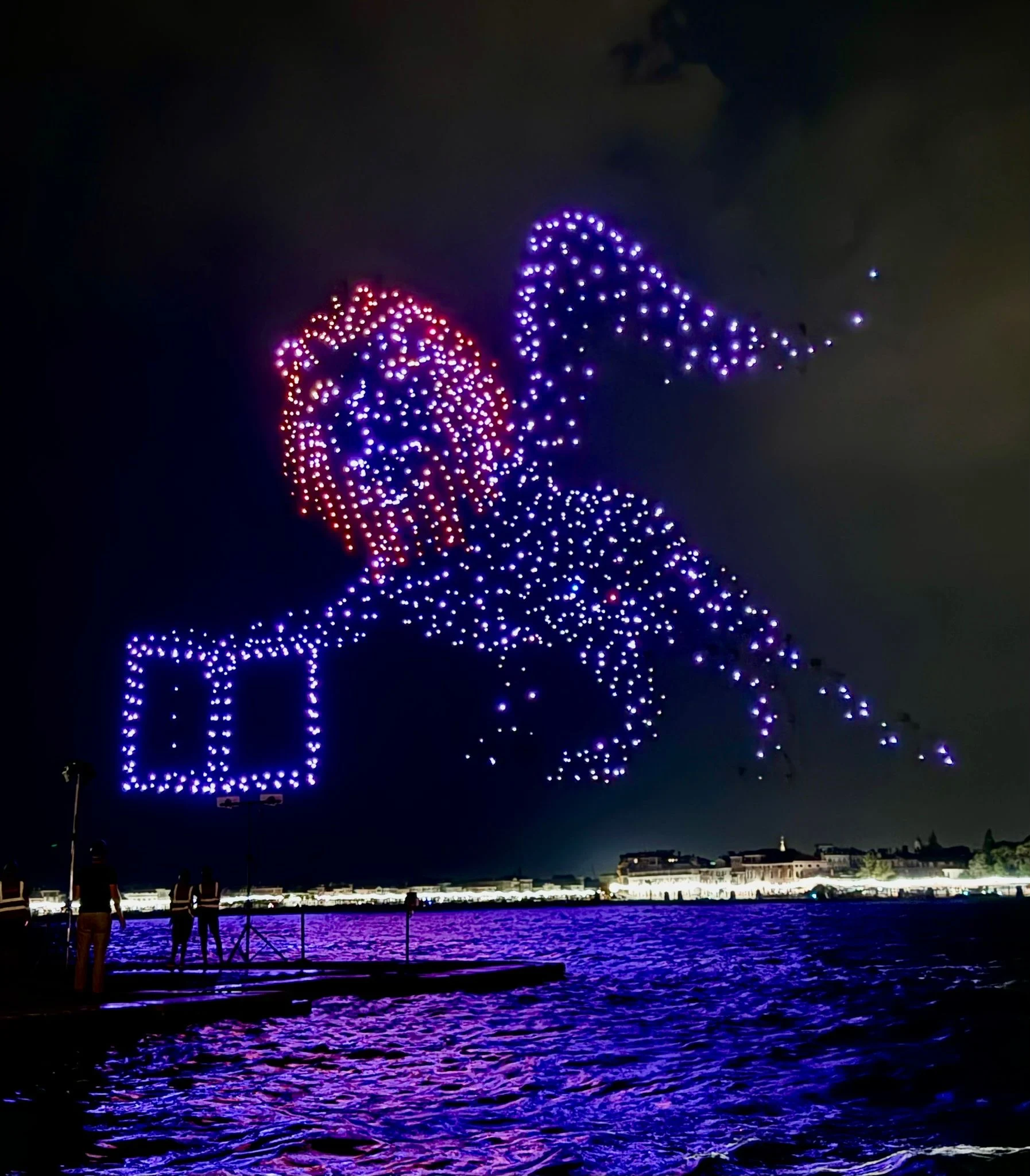 Drones drawing the winged lion of Venice holding a book in the night sky over the lagoon – Aperol Redentore Drone Show, Venice, Italy, 2024 – creative direction