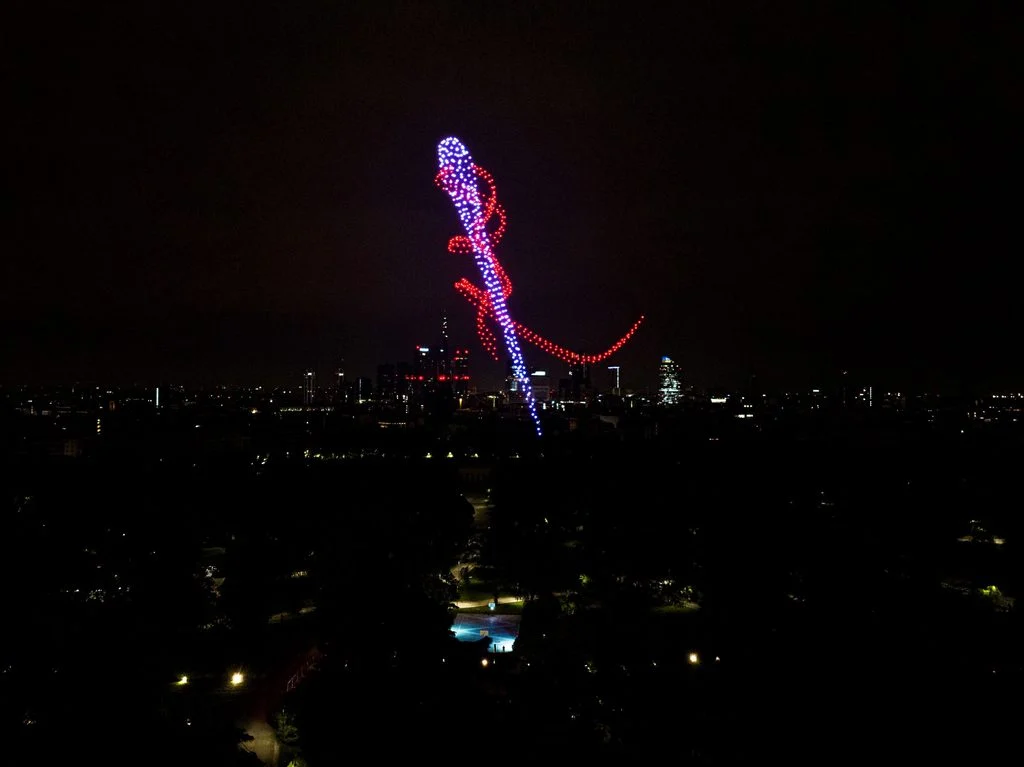 Drone formation of a needle and red thread above the Milan skyline at night – Milano House of Campari, Italy, 2023 – event design