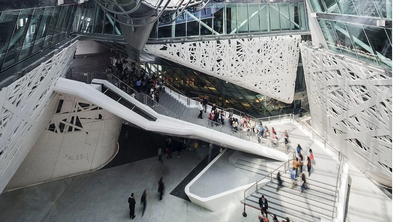 Interior of Palazzo Italia: white sculpted stair bridges crossing the atrium between perforated walls – Italian Pavilion at Expo 2015, Milan, Italy – exhibition design