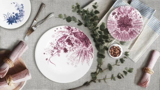 Table setting of plum botanical plates of different sizes, a blue plate, napkins in rings and eucalyptus – Botanica Tableware for Bitossi Home, 2017 – product design