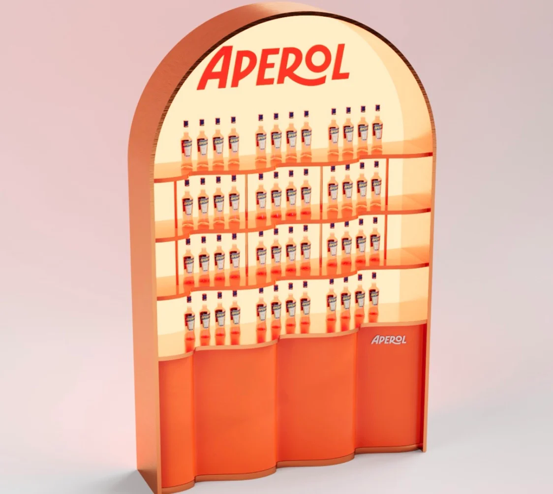 Render of an arched Aperol shelving unit stocked with bottles above a wavy orange base – Aperol Tool Kit, 2023 – product design