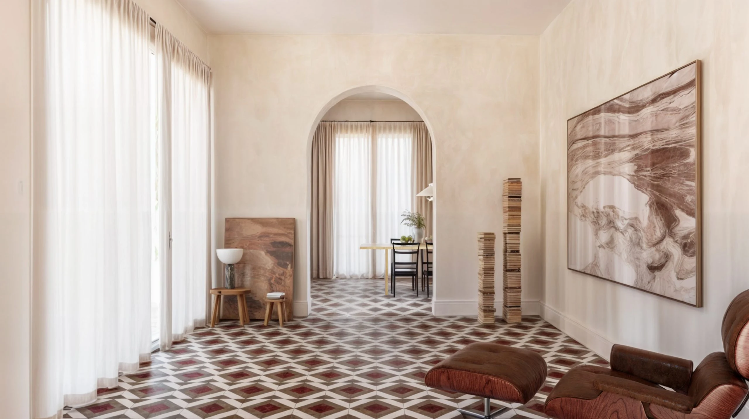 Living room with Murabba inlaid stone floor in a geometric pattern, arched doorway and leather lounge chair – Murabba Flooring for MIAMILANO, Italy, 2025 – product design