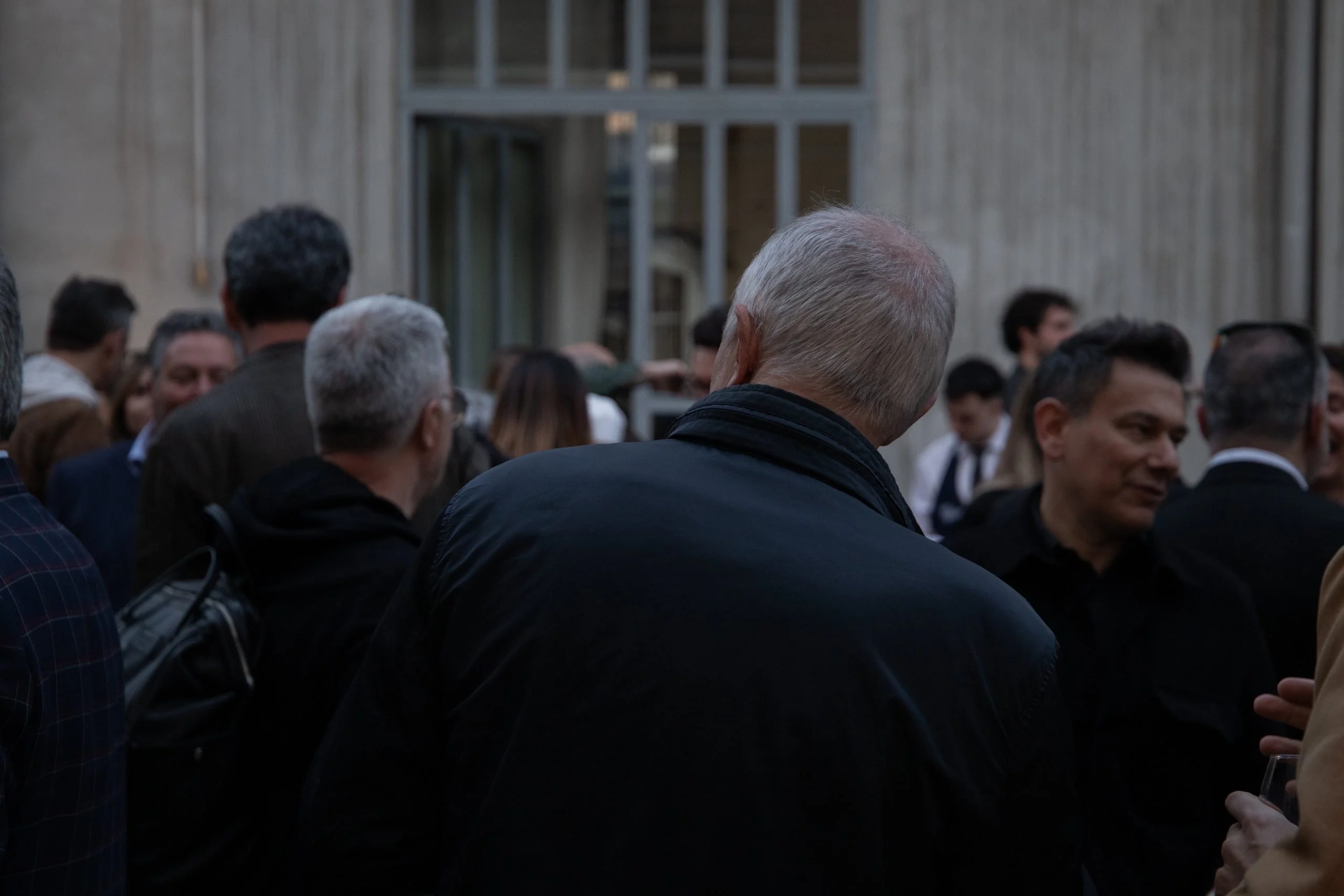 Guests gathered in the courtyard at dusk during the Fuorisalone party – Everything Is a Party at Fuorisalone, Milan, Italy, 2025 – event design