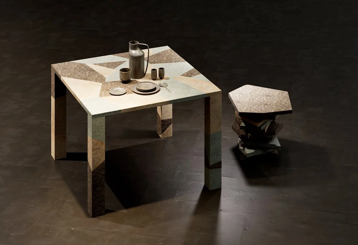 Porphyry table with a geometric inlaid top and a stacked-stone stool on a dark floor – Frammenti Collection for Porfido Pedretti, Milan, Italy, 2025 – product design