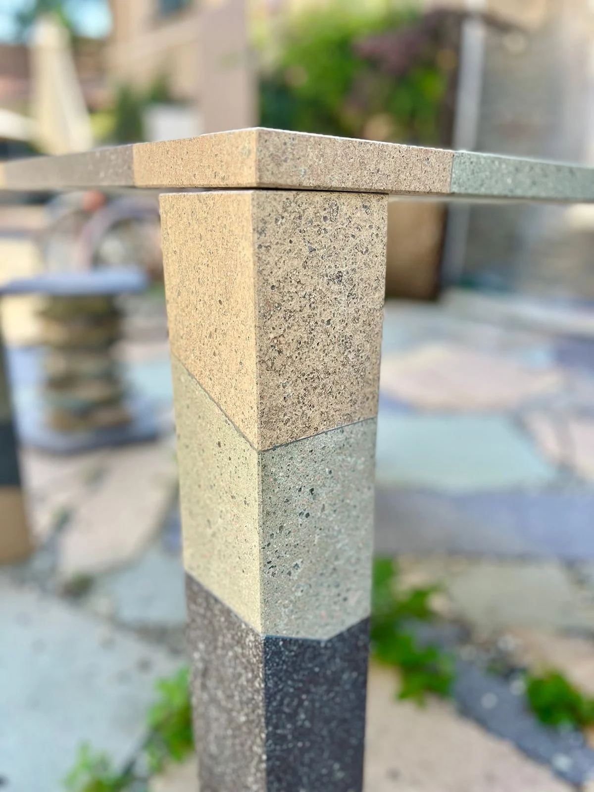 Close-up of a table leg in ochre, green and dark porphyry bands – Frammenti Collection for Porfido Pedretti, Milan, Italy, 2025 – product design