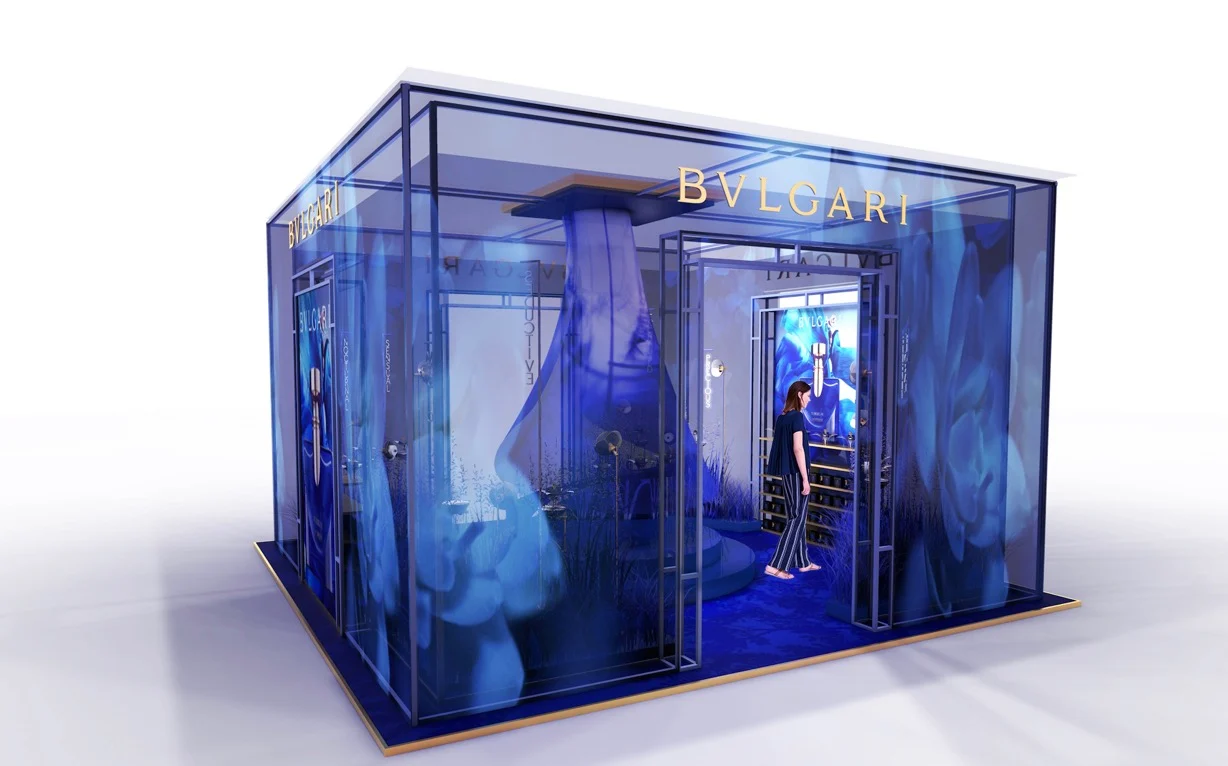 Render of the blue glass Bvlgari pavilion seen from outside, with tall flower graphics and a visitor inside – Bvlgari Splendida Tubereuse Mystique, 2019 – retail design concept