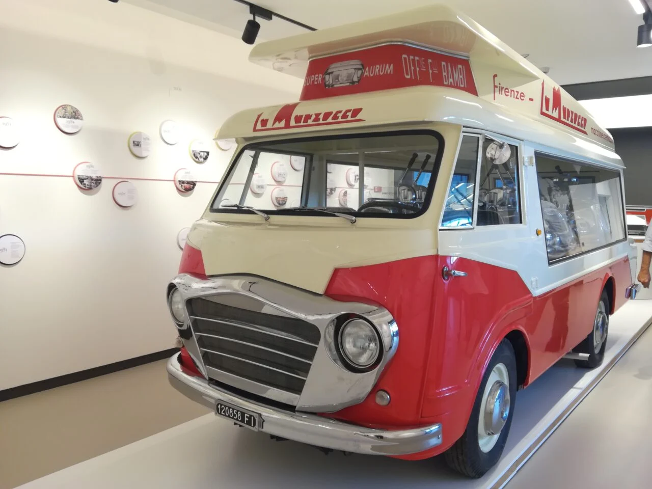 Vintage red and cream La Marzocco van displayed in the museum, front three-quarter view – La Marzocco Accademia del Caffè Espresso, Florence, Italy, 2018 – interior design