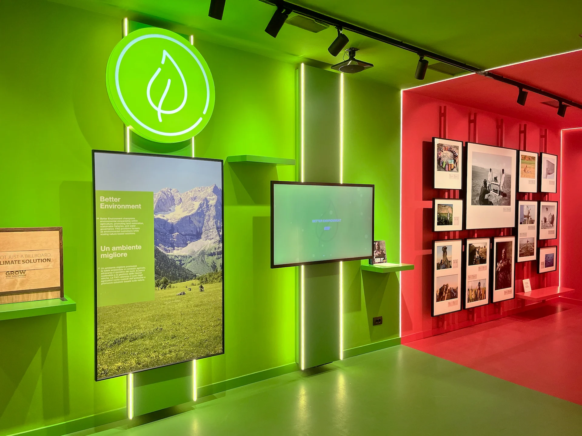 Bright green exhibition wall with a landscape screen beside a red room hung with framed photographs – FAO MuNe Food and Agriculture Museum, Rome, Italy, 2025 – exhibition design