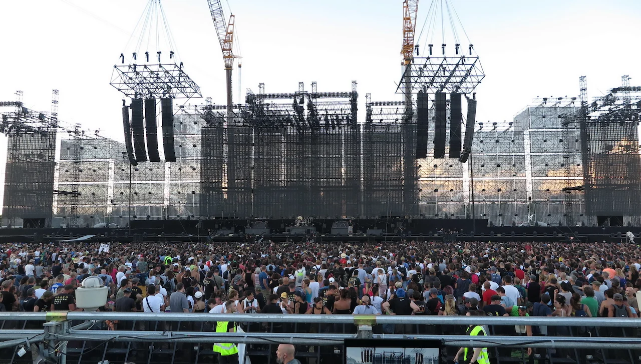 Daytime view of the vast Modena Park stage structure, scaffolding towers and speaker arrays above the crowd – Vasco Rossi Modena Park, Italy, 2017 – concert stage design